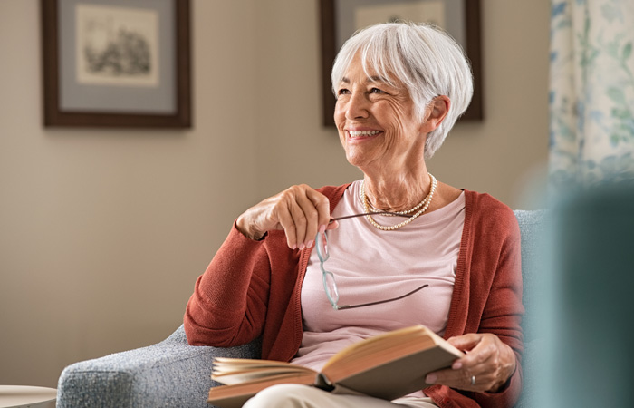 Smiling Resident Reading a book