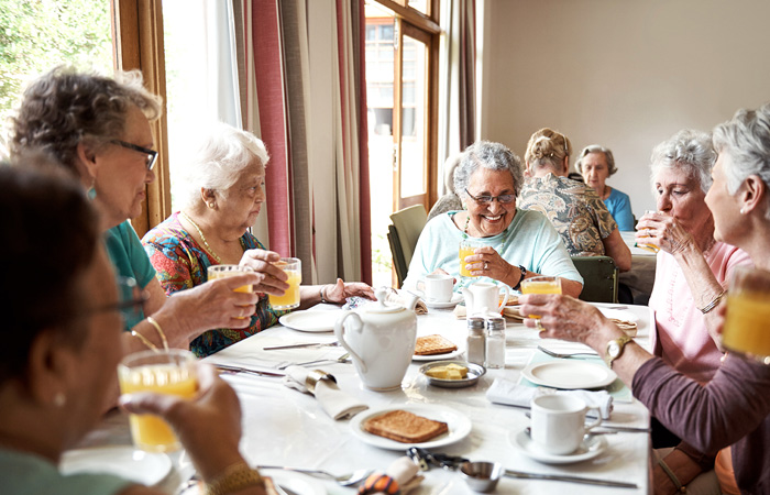Residents enjoying a meal together